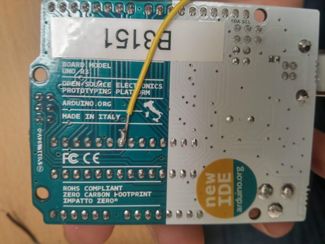 The back of the board with a wire soldered to the VDD contact.
